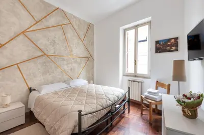 a bedroom with a large bed and a window at Vaticano San Pietro - Marisa Home - Check-in h24 in Rome