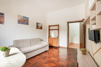 a living room with a couch and a television at Vaticano San Pietro - Marisa Home - Check-in h24 in Rome