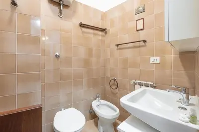 a bathroom with a toilet and a sink at Vaticano San Pietro - Marisa Home - Check-in h24 in Rome