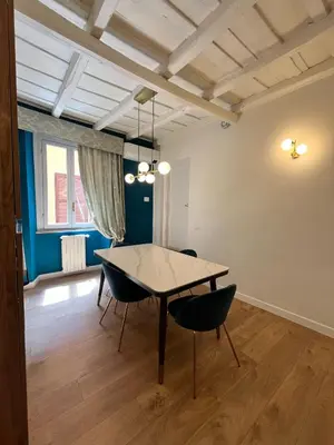 a dining room with a table and chairs at Paolina Place in Rome
