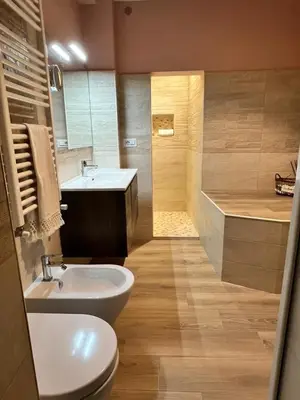 a bathroom with a sink and a toilet and a shower at Paolina Place in Rome