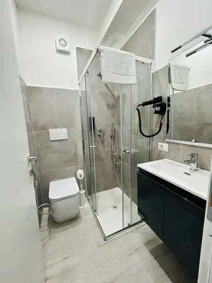 a bathroom with a shower and a toilet and a sink at Cappadocia Rooms in Rome