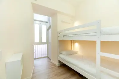 a bedroom with two bunk beds and a window at Trendy apartment at Vatican in Rome