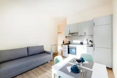 a living room with a couch and a table at Trendy apartment at Vatican in Rome