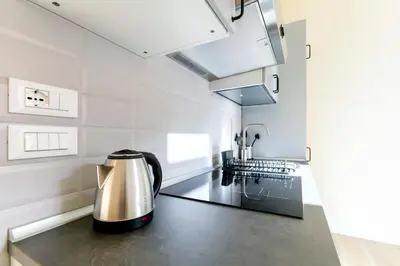 a kitchen with a tea kettle on a counter at Trendy apartment at Vatican in Rome