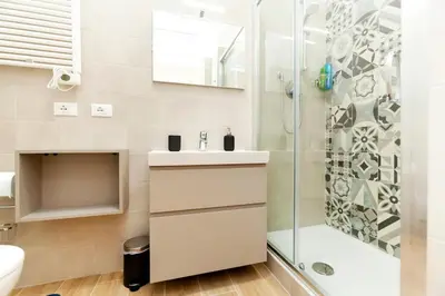 a bathroom with a shower and a sink at Trendy apartment at Vatican in Rome