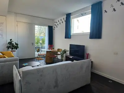 a living room with two couches and a tv at clivo56 San Pietro Loft in Rome