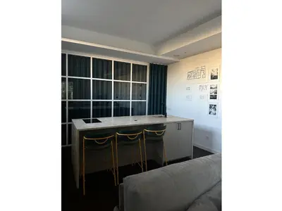 a living room with a table and a couch at clivo56 San Pietro Loft in Rome