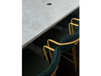 a table with chairs and a counter top at clivo56 San Pietro Loft in Rome