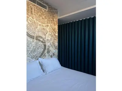 a bedroom with a bed and a brick wall at clivo56 San Pietro Loft in Rome