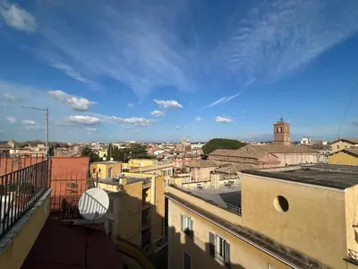 a view of a city from the roof of a building at Loft Trastevere in Rome