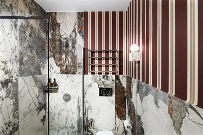 a dirty bathroom with a shower and a toilet at Alma at Colosseum Luxury Apartment with View in Rome