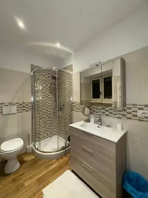 a bathroom with a sink and a toilet and a shower at Nicoletti in Rome