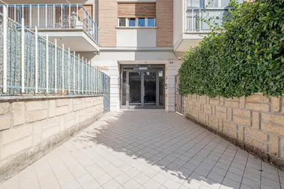 a building with a walkway in front of a building at La Terrazza Loft near San Pietro in Rome