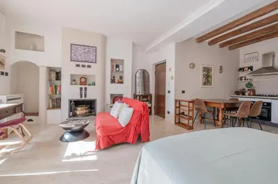 a living room with a couch and a table at La Terrazza Loft near San Pietro in Rome