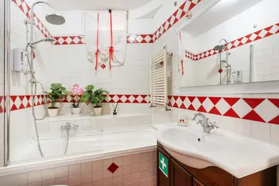 a bathroom with a tub and a sink at Vatican San Pietro - Giulia House in Rome