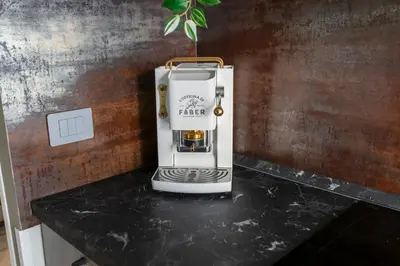 a coffee machine sitting on top of a counter at Hotelleria Prestige in Rome