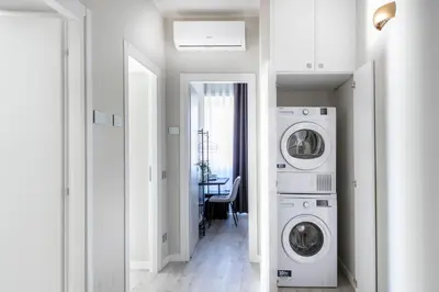a laundry room with a washer and dryer at Hotelleria Prestige in Rome