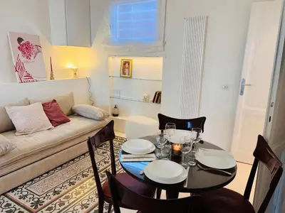 a living room with a table and a couch at Clarus apartment in Rome in Rome