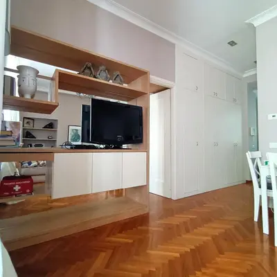 a living room with a flat screen tv on a counter at Colosseo Elegant Apartment in Rome