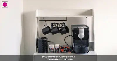 a kitchen with a coffee maker and a coffeemaker at Desideri di Roma - Basilica San Paolo - Ospedale Bambin Gesu'-Roma III - 8th Piano Vicino la Metro in Rome