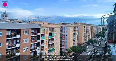 a view of a city with buildings and cars at Desideri di Roma - Basilica San Paolo - Ospedale Bambin Gesu'-Roma III - 8th Piano Vicino la Metro in Rome
