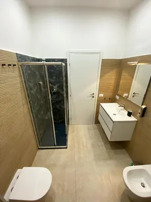 a bathroom with a toilet and a sink at Domus Quadraro II in Rome
