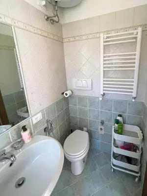 a bathroom with a toilet and a sink at Bed Bike Breakfast Appartamento Piramide in Rome