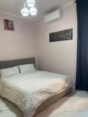 a bedroom with a bed in a white room at Ines Stay in Rome