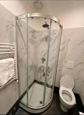 a shower stall in a bathroom with a toilet at Ines Stay in Rome