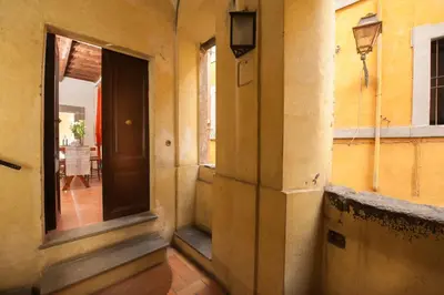 an empty hallway of a house with a door at La Maison de Kappa in Rome