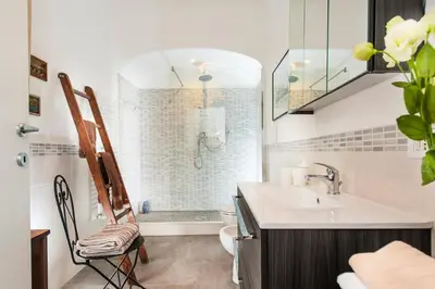 a bathroom with a sink and a toilet and a shower at La Maison de Kappa in Rome