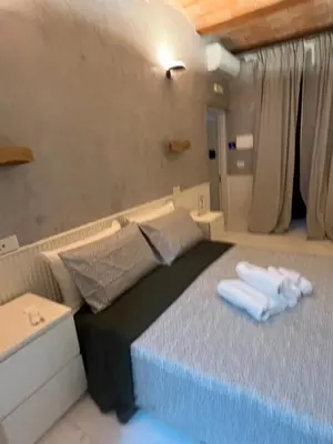 a bedroom with a bed with two towels on it at Villafranca17 in Rome