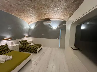 a living room with a bed and a couch at Villafranca17 in Rome
