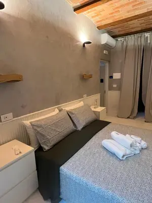 a bedroom with a bed with towels on it at Villafranca17 in Rome
