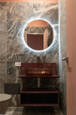 a bathroom with a sink and a mirror at Colonna Collection in Rome