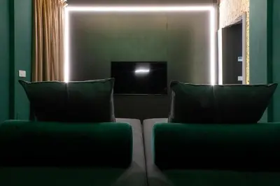 a couch with two pillows in a living room at Colonna Collection in Rome