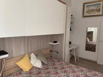 a bedroom with a bed with pillows on it at Apartment in Testaccio in Rome