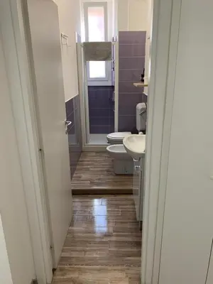 a bathroom with two toilets and a sink at Apartment in Testaccio in Rome