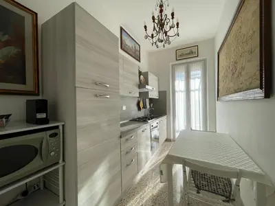 a kitchen with a table and a sink in it at Mazzoni Suite, Panoramic Terrace and Comfort in Rome