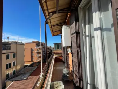 an apartment balcony with a view of a building at Mazzoni Suite, Panoramic Terrace and Comfort in Rome