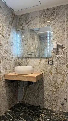 a bathroom with a sink and a mirror at Bed and Breakfast Eritrea in Rome