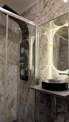 a bathroom with a glass shower with a sink at Bed and Breakfast Eritrea in Rome