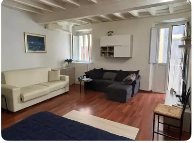 a living room with a couch and a table at Casa in centro storico Largo Argentina in Rome