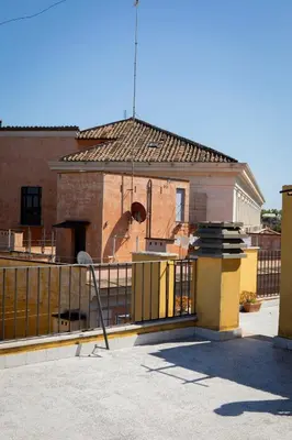 a building with a gate in front of it at Casa Carmine in Trastevere in Rome
