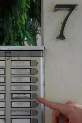 a hand pointing at a key on a computer keyboard at Vatican City Historic Center -Luxury Flat with Garden and Private Parking in Rome