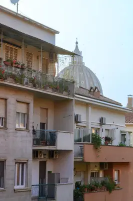 a building with a dome on top of it at Vatican City Historic Center -Luxury Flat with Garden and Private Parking in Rome