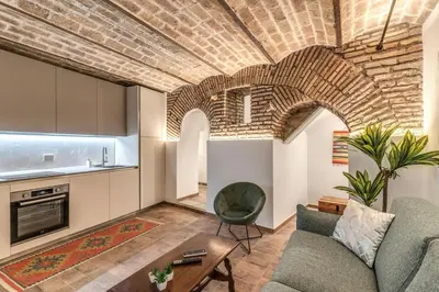 a living room with a couch and a table at La Casa Dei Sogni in Rome