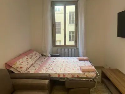 a small bedroom with a bed and a window at Rosa di San Giovanni in Rome