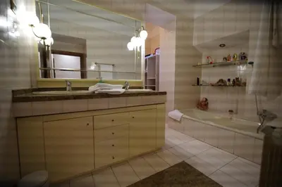 a bathroom with a sink and a tub and a mirror at Domus Roma G&R in Rome